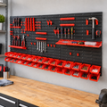 30-bin wall-mounted parts organizer holding screws and hand tools above a garage workbench